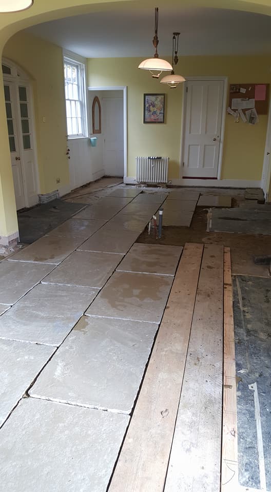 Old flooring had to be taken up for repair work to be carried out on pipes underneath, new underfloor heating was laid on insulated mats then 900x600 natural stone flag stones were laid.